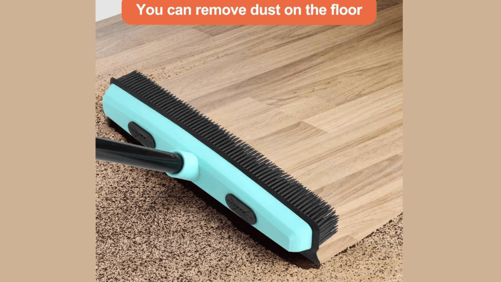 Close-up of fur remover broom rubber bristles lifting pet hair from carpet.